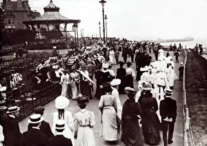 Men And Women Prints: Edwardian Ladies and Gentleman walk up and down the promenade of an unnamed English South