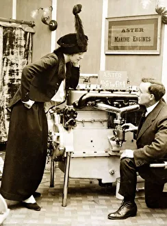 1913 Prints: An Edwardian lady listen to an explanation of how the Aster marine Engine works