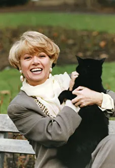 Elaine Paige holding black cat smiling at press call - 09 / 05 / 1992