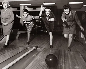 Four elderley women who are part of a newly formed tenpin bowling team practcie their