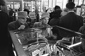 Southend Prints: Two elderly ladies seen here caught up in the excitement of playing the slot machines