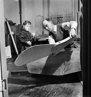 00009 Prints: An elderly man in dining room with his grandson building the Royal yacht