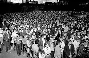 Election night scene in Trafalgar Square as people watch Ted Heath