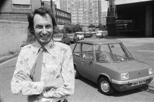 Motoring Prints: The Electric Car. A new unusually quiet little motor car can be seen going