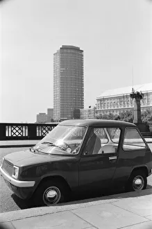 The Electric Car. A new unusually quiet little motor car can be seen going