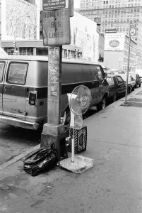 United States Of America Prints: Electric free standing fan, abandoned on street pavement, under sign, Domenico Bus Lines