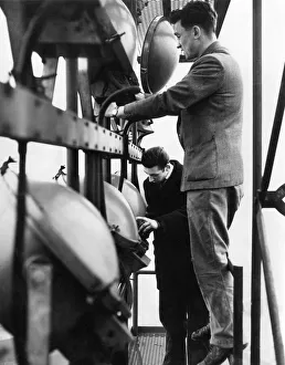 Electricians checking the lights in one of the 114ft floodlight towers at St Andrews