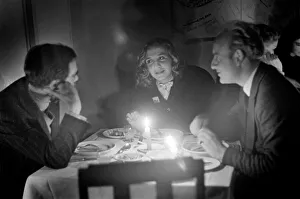 Electricity Cut. Dining by candlelight in a restaurant during the fuel crisis
