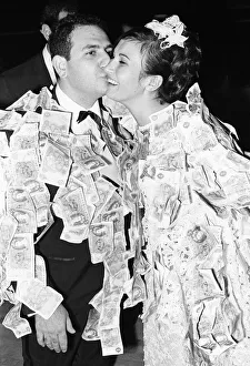 00702 Prints: Elias Nicholas kisses his new bride and Katerina following the money dance at a