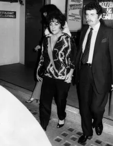 00004 Prints: Elizabeth Taylor actress seen leaving a London Jazz bar