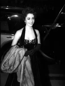 Elizabeth Taylor attends the premiere of The Lady with the Lamp