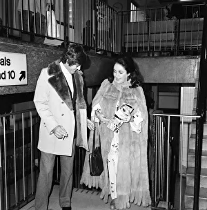 Fur Coat Prints: Elizabeth Taylor with Henry Wynberg seen here arriving at Heathrow Airport