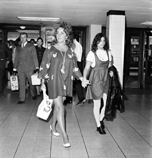 Elizabeth Taylor and Richard Burton with daughter Liza leave London Airport (Heathrow