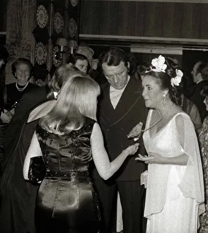 Admiration Prints: Elizabeth Taylor with Richard Burton at her40th Birthday party showing off