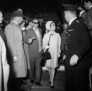 Elizabeth Taylor walking to her seat at Wembley Stadium for the Cassius Clay