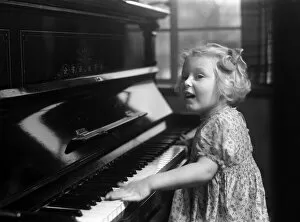 01188 Collection: Ella Edwards playing the piano. January 1941