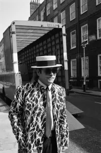 Elton John arriving at court. Elton is asking for a bigger share of the 20 million his
