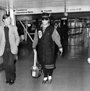 Images Dated 23rd December 1980: Elton John arriving at Heathrow Airport from Perth. 23rd December 1980