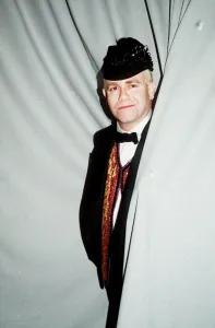 Knighthood Prints: Elton John concert Palais de Sports Paris cap bow tie standing in curtain