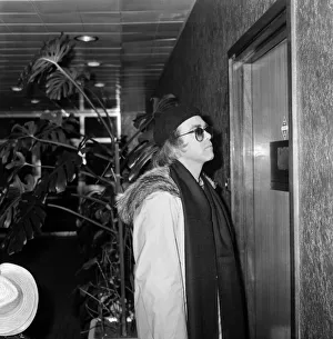 Elton John departing from Heathrow airport to New York for a recording session