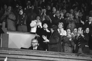Chairman Prints: Elton John and fans watching the Watford v Gillingham football match. 11th November 1978