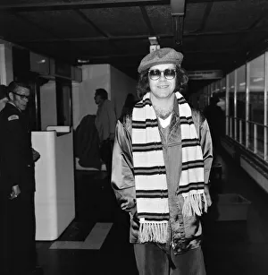 Elton John at Heathrow airport before flying to Moscow for a concert tour. 20th May 1979
