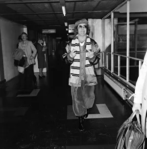 Elton John at Heathrow airport before flying to Moscow for a concert tour. 20th May 1979