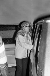 Elton John leaving the Empire Pool Wembley by the back door after he announced his
