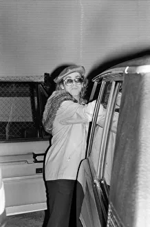 01320 Prints: Elton John leaving the Empire Pool Wembley by the back door after he announced his