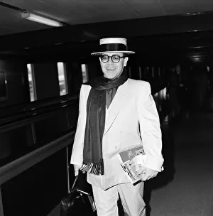 Elton John leaving Heathrow Airport for Barbados on his way to make a new record