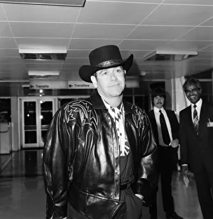 Leather Prints: Elton John leaving Heathrow Airport for New York on Concorde. 13th August 1984