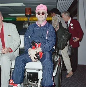 Pianist Prints: Elton John at London Heathrow Airport. 18th July 1990