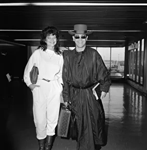 Elton John and his new wife Renate arriving at Heathrow Airport from Hong Kong