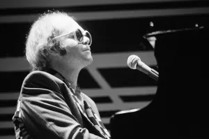 Elton John performing on stage, during the Elton John and Ray Cooper concert tours