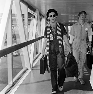 01319 Prints: Elton John pictured on his arrival from a recording session in Los Angeles