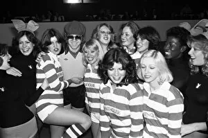 Images Dated 6th November 1977: Elton John pictured with Bunny Girls and Penthouse Pets during a 5 a side football match