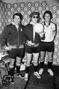 Elton John pictured with Graham Taylor and another player in Wembley during a 5 a side