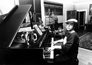 01351 Collection: Elton John pictured seated at a piano. December 1978. Published in