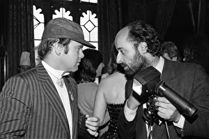 Elton John pictured talking to a photographer at a House of Commons reception