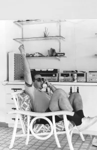 Knighthood Prints: Elton John pop singer listens to commentry on Watford game in the recording studios in