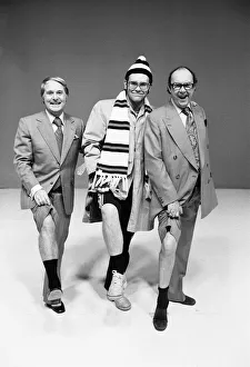Socks Prints: Elton John poses with comedians Ernie Wise (left) and Eric Morecambe as he appears