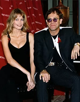 Images Dated 12th May 1993: Elton John singer with Claudia Schiffer model