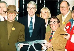Elton John singer John Major and Ronnie Corbett help launch an appeal for old specs to be