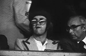 Spectator Prints: Elton John watching the Reading v Watford football match. League Cup 1st round 2nd leg