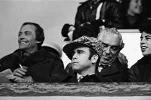 Chairman Prints: Elton John watching the West Ham United v Watford football match. 7th January 1978