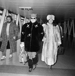 Elton John and wife Renate leaving Heathrow Airport for Washington where he is to play
