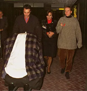 Emma Thompson and Greg Wise arriving at Heathrow airport from Los Angeles