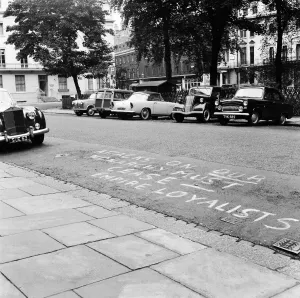 Empire Loyalists paint slogans on homes of the Queens critics. 18th August 1957