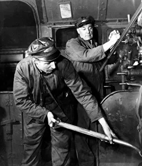 Engine driver and fireman at work on a British Railways locomotive, February 1954