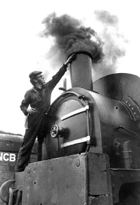 An Engineer giving his steam locomotive a last clean before going on show to the public